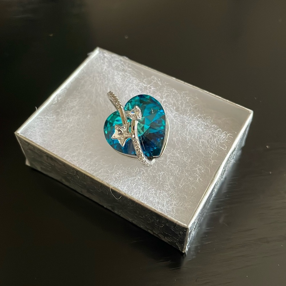 Blue heart pendant necklace with star charm.